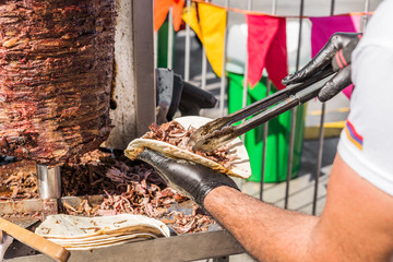 Chef preparing kebab and grill shawarma meat at a street food market