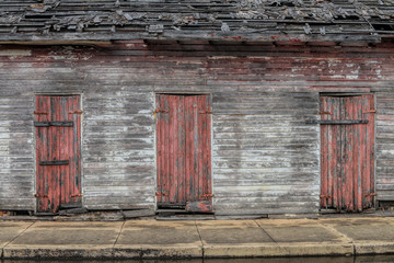 three doors on a wood building
