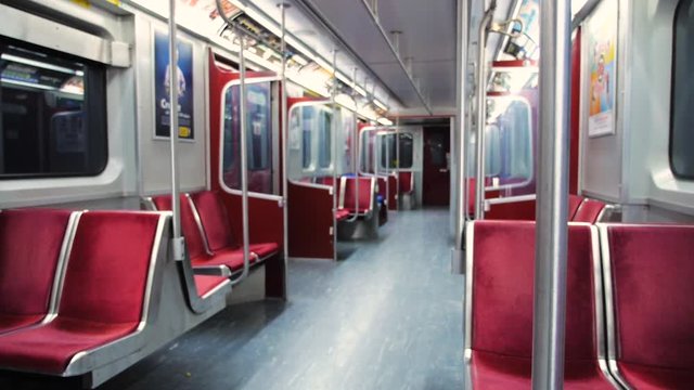 Shallow focus shot of riding an empty subway car late at night
