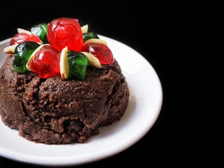Christmas pudding on black background