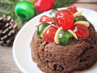 Christmas pudding with berry and decoration