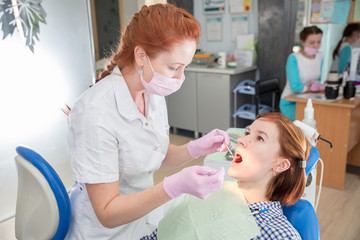 young woman patient at  dentist's reception
