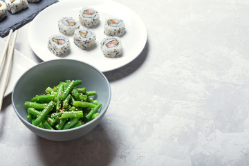 Japanese sushi and green beans on a white background