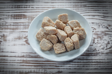 Vintage sugar plate on wooden board