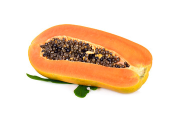 half cut ripe papaya with seed and leaf on white background