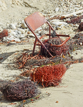 Rusty Chair on Beach