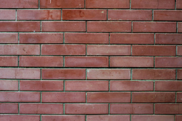 Red brick old wall with cracks, urban background, texture