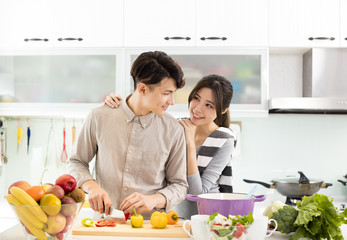 happy asian Couple cooking in the kitchen