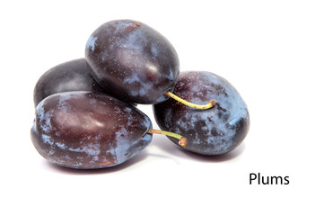 Plums plum prunes prune slice organic fruits fruit isolated on a white background