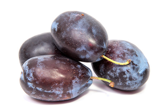 Plums plum prunes prune slice organic fruits fruit isolated on a white background