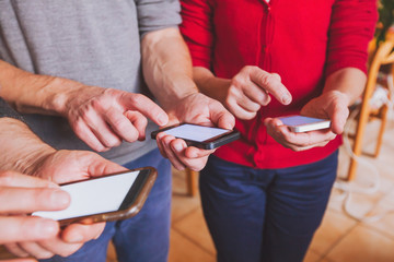 hands of people using smartphones, online communication or social network concept