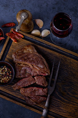 Grilled striploin beef steak with red wine