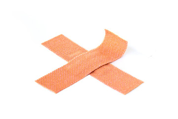 Two crossed adhesive bandages