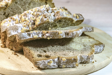 Fresh home baked cake, sliced and dusted with powdered sugar