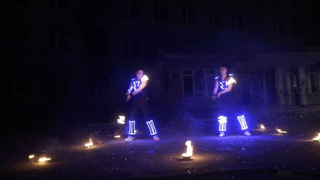 Beautiful fire show in the performance of two guys