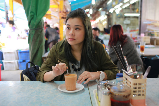 Girl Have Breakfast In The Cafe In Chinese Asian Wet Market