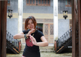 the girl pose as kung fu in the old interior mansion in chikan old town
