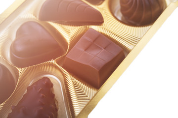 A collection of mixed chocolates against a white background