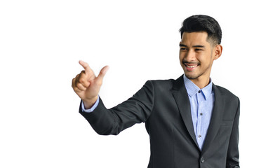 Young business man pointing at something interesting on a white background