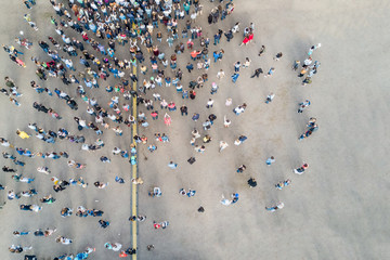 View from the drone of the crowd of people on the asphalt