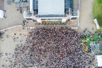 View from above of a crowd of people near the stage