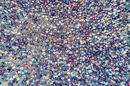 View from the height of the crowd of people on the asphalt