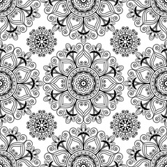 Mehndi henna seamless background with buta decoration items in Indian style.