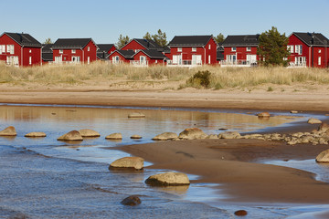 Red wooden houses near Marjaniemi beach, Hailuoto island. Finland © h368k742