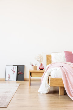 Pink bedroom with handmade posters