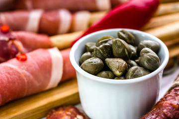 Bowl of capers, italian antipasti, traditional food from italy or mediterranean cuisine ingredient