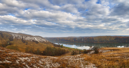 Autumn landscape. Cretaceous hills of the Don River. View on the pond on a background of cloudy sky.