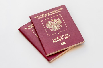 Two red Russian passports on a white background. Isolated
