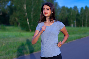 Teen girl runner in the park
