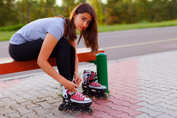 Teen girl dresses roller skates