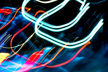 Abstract colurful lights, cars and road at night