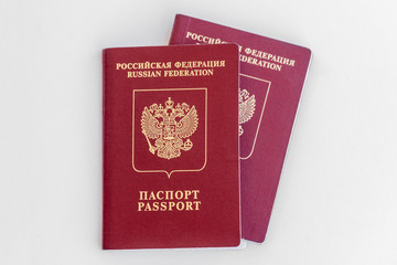 Two red Russian passports on a white background. Isolated