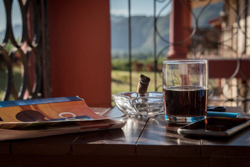 Book, cigar and cuba libre at Vinales, Cuba