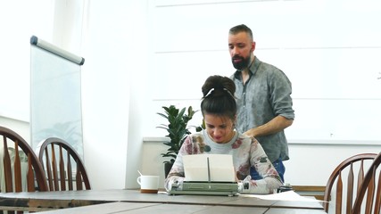 Two writers man and woman at work