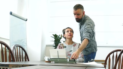 Obraz premium Two writers man and woman at work