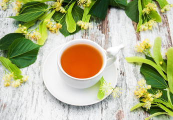 cup of herbal tea with linden flowers