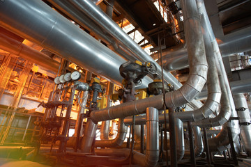 Equipment, cables and piping as found inside of a modern industrial power plant