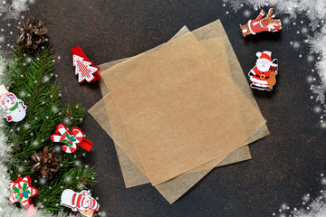 New Year card. Letter for Santa. Christmas tree and decorative clothespins on a brown background with space under the text.
