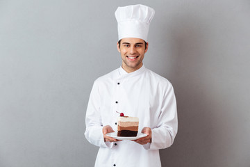 Portrait of a happy male chef dressed in uniform