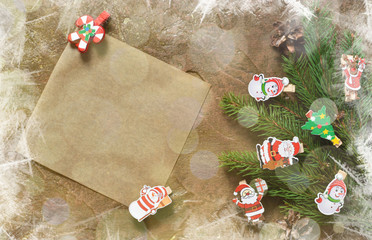 New Year card. Letter for Santa. Christmas tree and decorative clothespins on a brown background with space under the text.