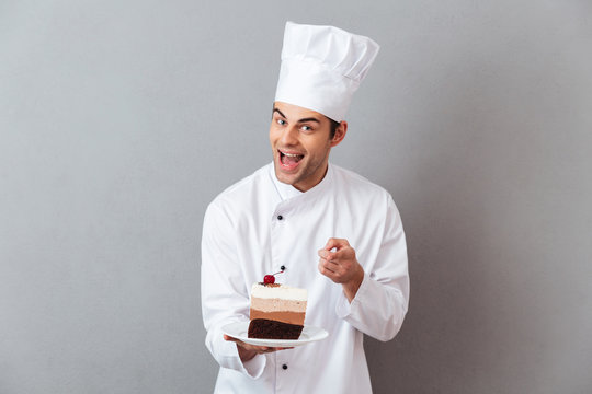 Portrait of a cheerful male chef dressed in uniform