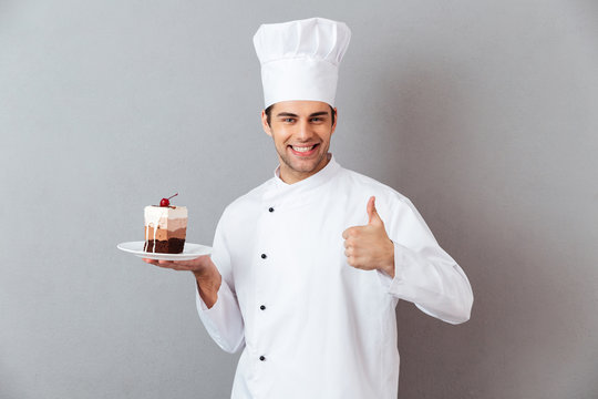 Portrait of a smiling male chef dressed in uniform