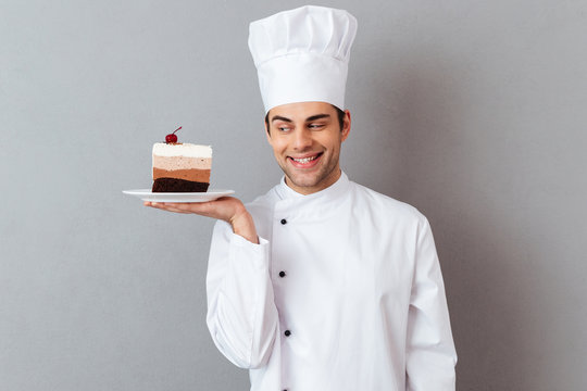 Portrait of a smiling male chef dressed in uniform
