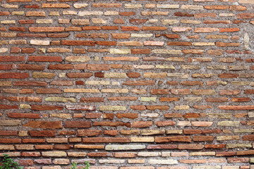 Weathered red brick wall