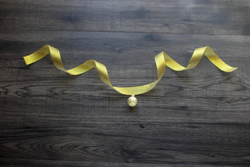 Golden ribbon with little ball