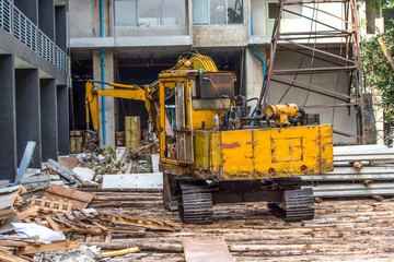 Yellow machine working in the construction aria
